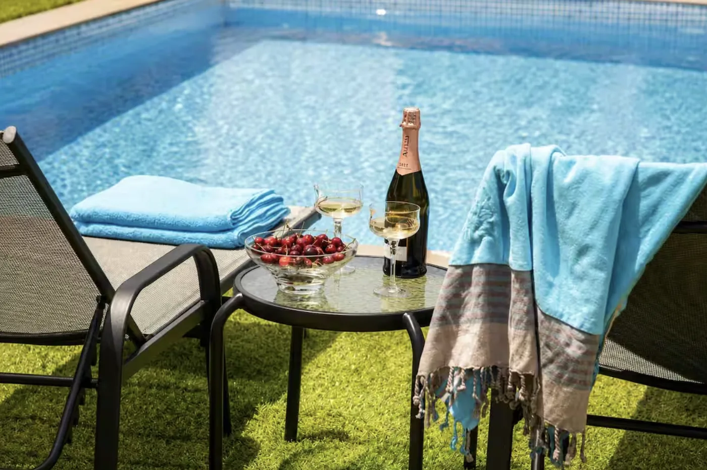 Sun loungers and towels by the private pool at Villa Morea